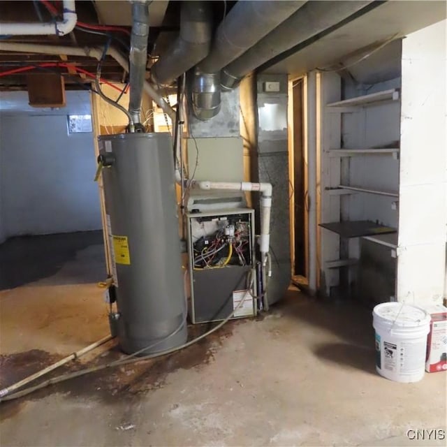 utility room featuring water heater and heating unit