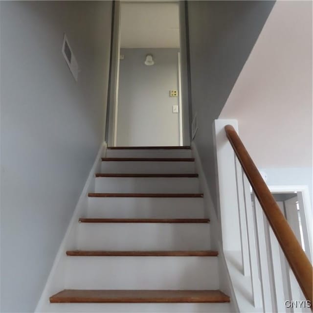 staircase featuring visible vents