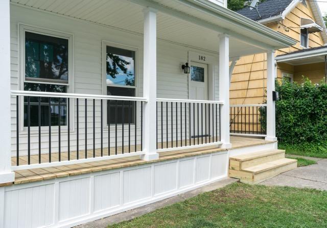 view of property exterior with a porch