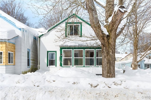 view of snow covered house