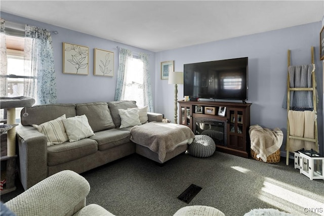 living area featuring carpet flooring