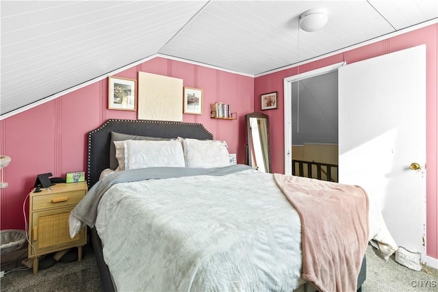 bedroom with lofted ceiling and carpet