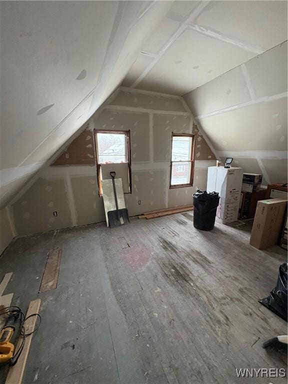 additional living space featuring vaulted ceiling