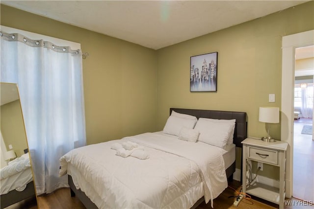 bedroom featuring wood finished floors