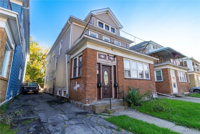 view of front of house featuring brick siding