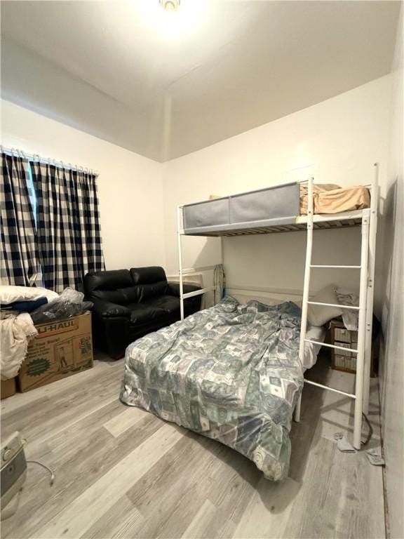 bedroom featuring wood finished floors