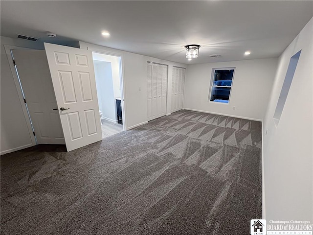 unfurnished bedroom with carpet floors, baseboards, visible vents, and recessed lighting