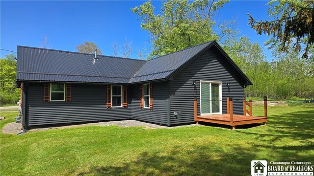 5417 Rte 5, Portland, NY 14769 - back of property featuring a lawn, metal roof, and a deck