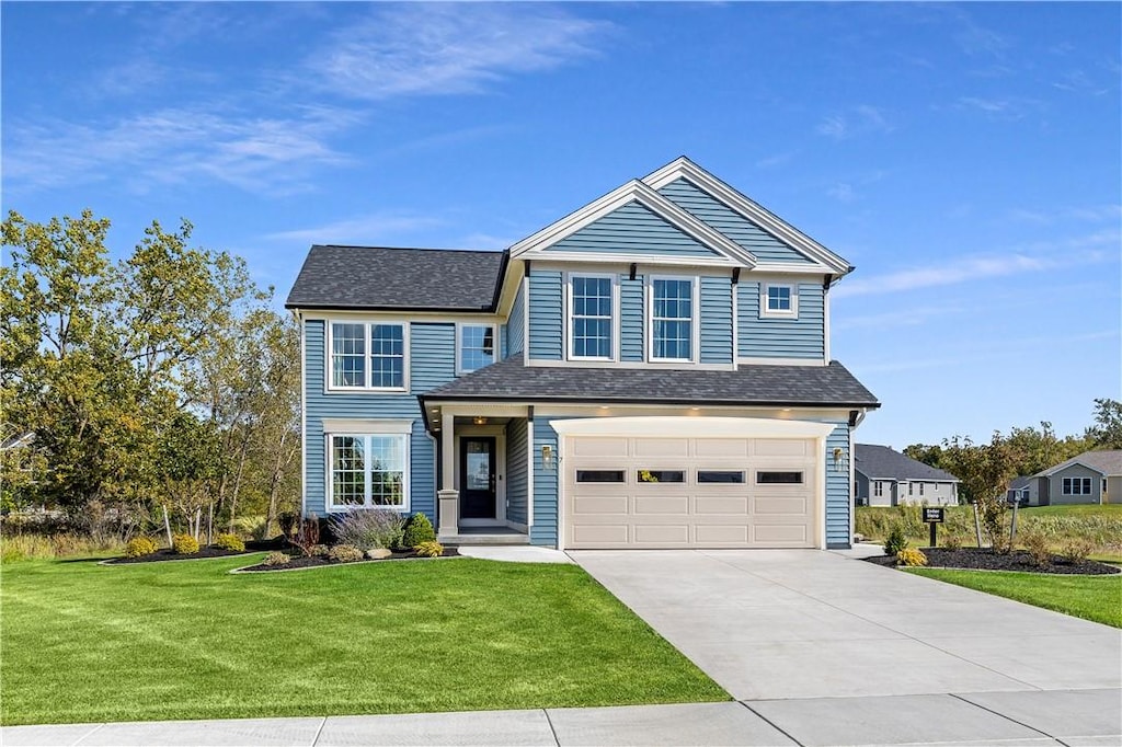 view of front of house featuring a garage, concrete driveway, a shingled roof, and a front lawn