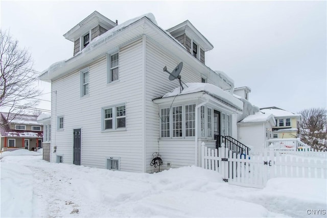 view of front of house with fence