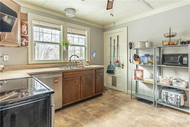 kitchen featuring stainless steel electric range oven, light countertops, a sink, and dishwasher