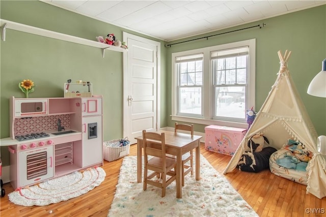 recreation room with wood finished floors