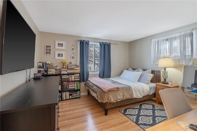 bedroom featuring light wood finished floors