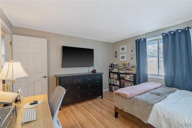 bedroom featuring light wood-style floors