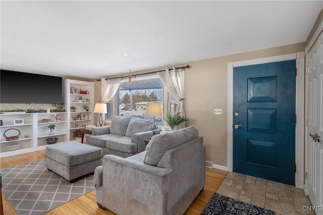 living room featuring light wood-style floors and baseboards