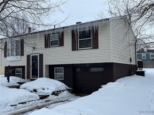 bi-level home with an attached garage