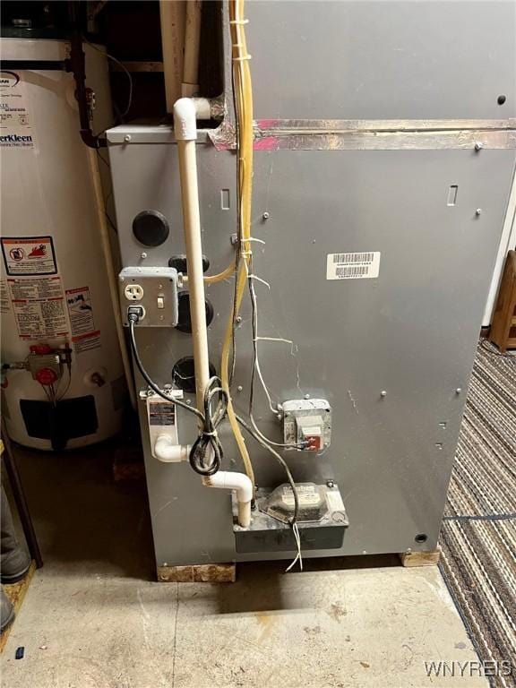 utility room featuring gas water heater and heating unit