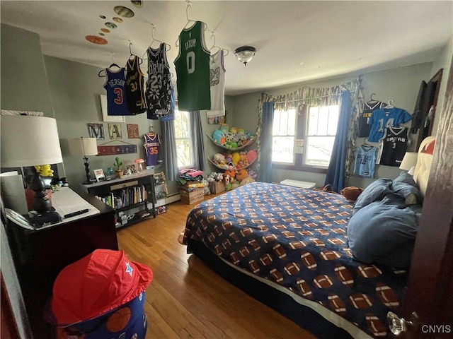 bedroom featuring wood finished floors