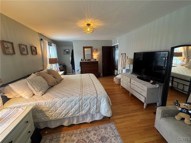 bedroom featuring light wood-style floors