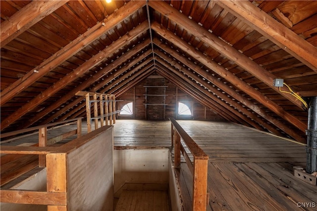 attic featuring an upstairs landing