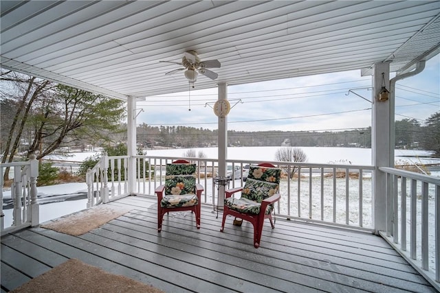 snow covered deck featuring ceiling fan