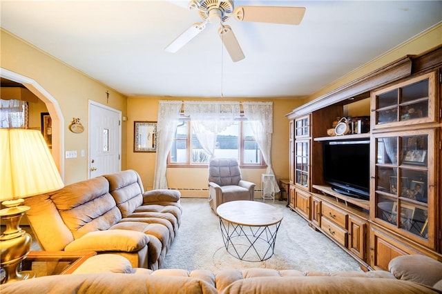 living area featuring arched walkways, light carpet, ceiling fan, and baseboard heating