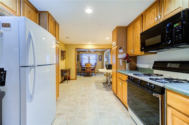 kitchen with light countertops, white appliances, and brown cabinets