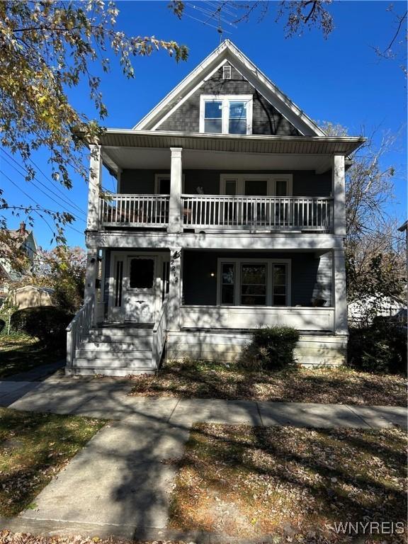 view of front of house featuring a balcony