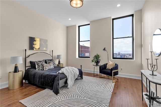 bedroom featuring recessed lighting, baseboards, and wood finished floors