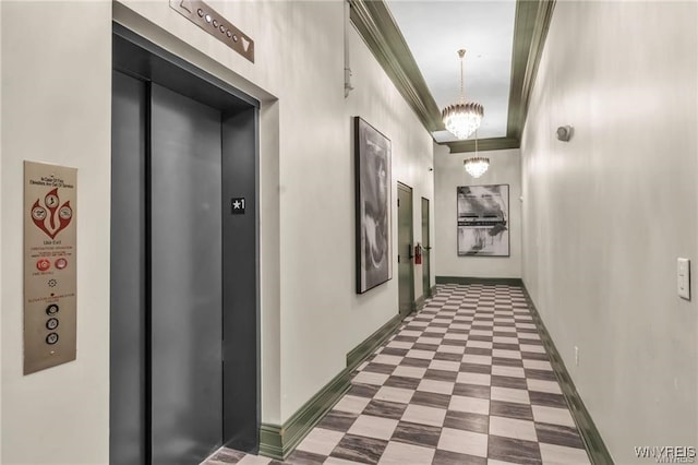 hallway featuring baseboards, elevator, ornamental molding, tile patterned floors, and a chandelier