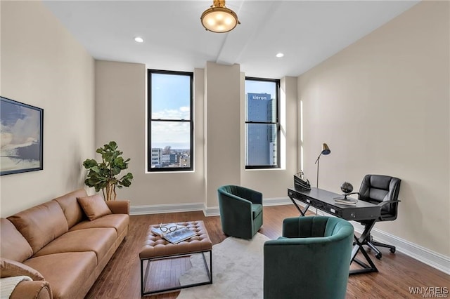 living room featuring recessed lighting, wood finished floors, and baseboards