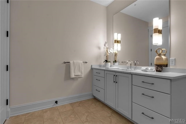 bathroom with baseboards and vanity