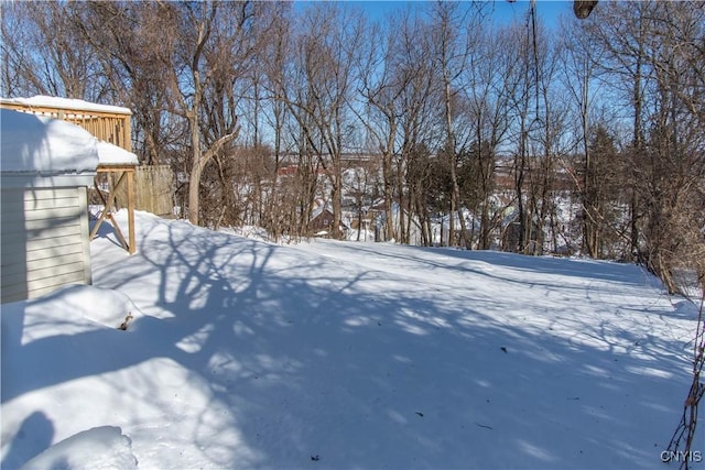 view of yard layered in snow