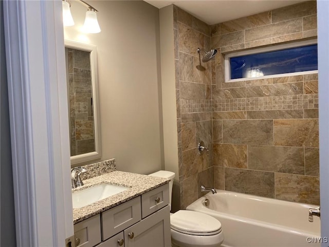 bathroom featuring toilet, shower / tub combination, and vanity