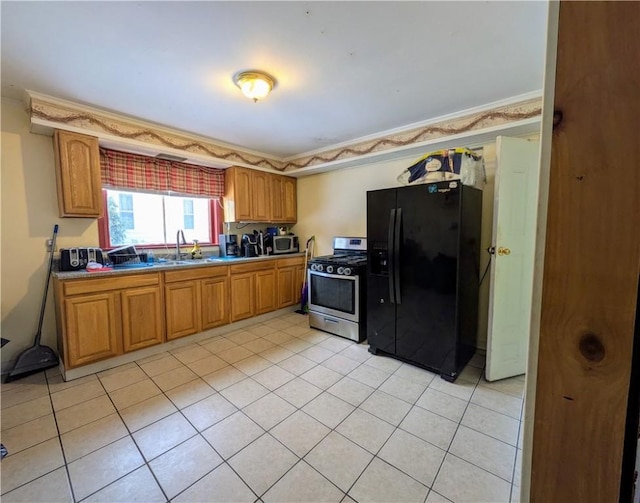 kitchen featuring stainless steel appliances, light countertops, brown cabinets, and light tile patterned floors