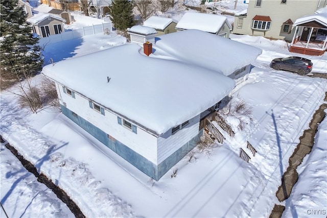 snowy aerial view featuring a residential view