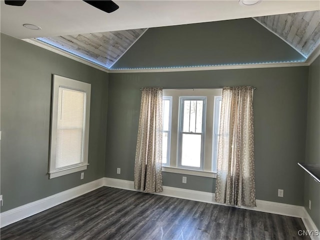 unfurnished room with dark wood-style flooring, vaulted ceiling, and baseboards