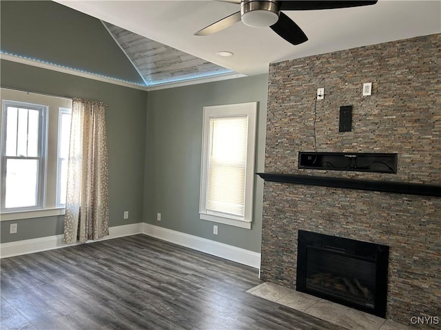 unfurnished living room featuring a fireplace, wood finished floors, and baseboards