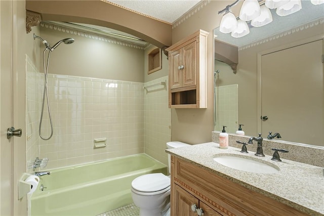 bathroom with toilet, shower / washtub combination, a textured ceiling, and vanity