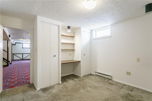 closet with a baseboard heating unit