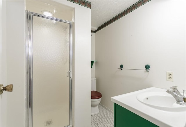 bathroom with a stall shower, toilet, tile patterned floors, a textured ceiling, and vanity