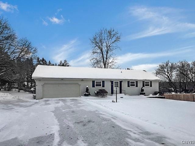 ranch-style house featuring a garage