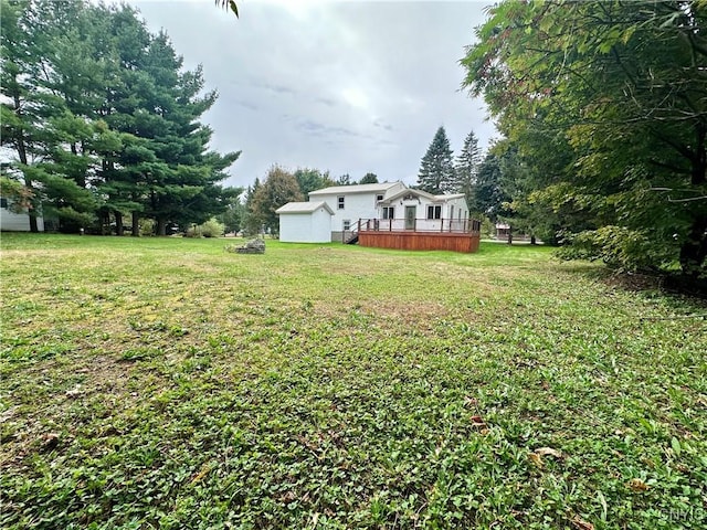 view of yard with a wooden deck