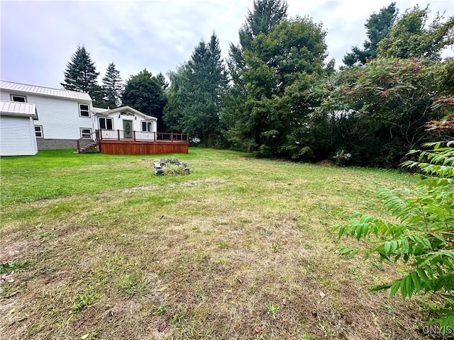 view of yard featuring a wooden deck