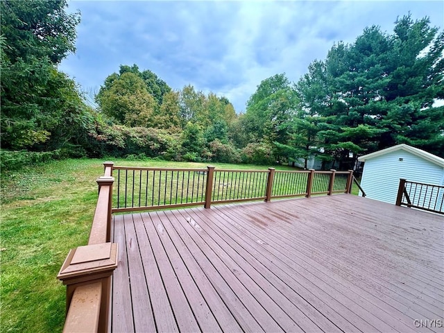 wooden deck with a lawn