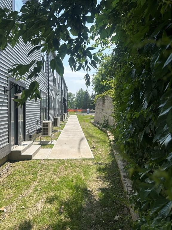 107 Water St Unit A1, Milo, NY 14527 - view of grassy yard featuring a patio