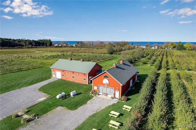 bird's eye view with a water view and a rural view