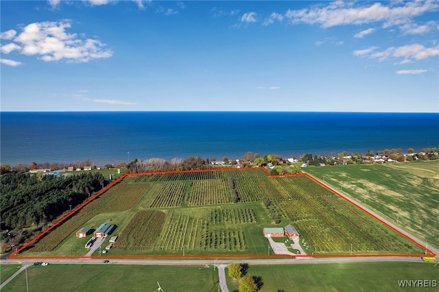 aerial view with a rural view and a water view