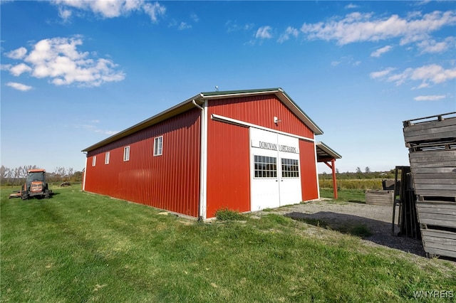 view of pole building with a yard