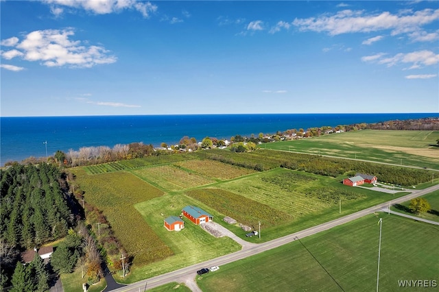 drone / aerial view featuring a water view and a rural view